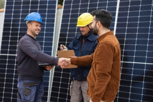 Solar Installers Shaking Hand with Owner and Closing Loan Agreement